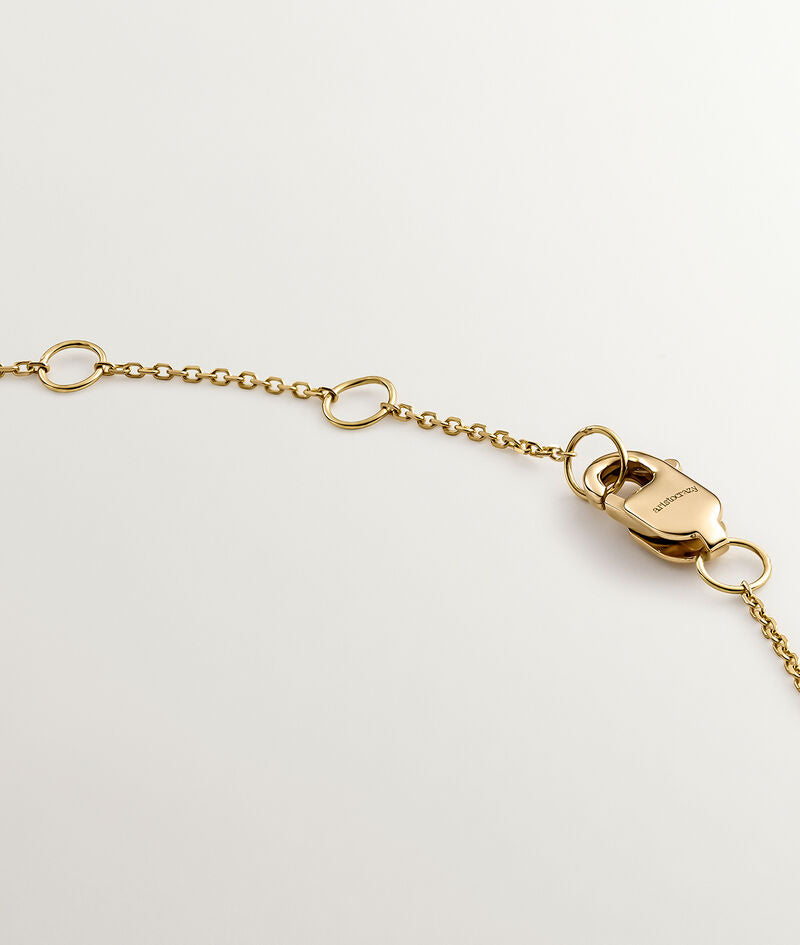 Colgante de oro amarillo de 18k con diamantes con forma de pez